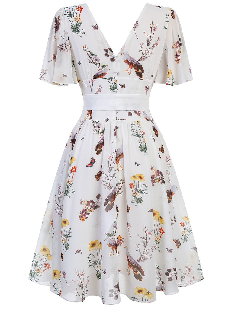 [Pré-vente] Robe blanche à col en V avec nœud et motifs de fleurs et d'oiseaux