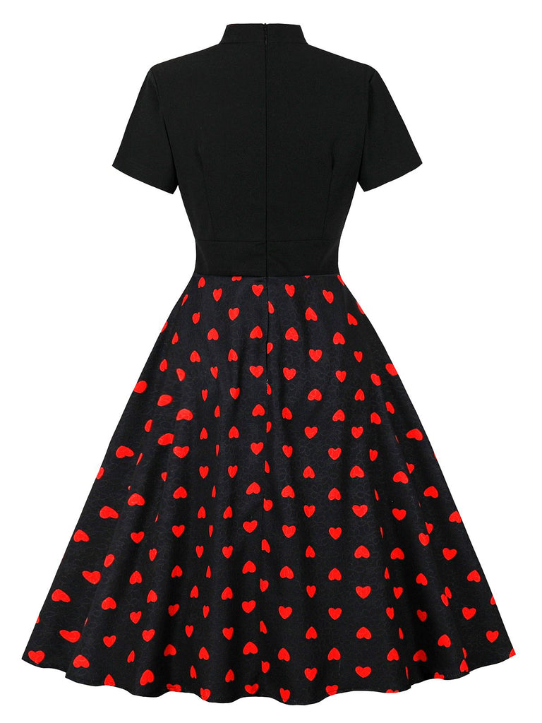 Robe noire à pois de cœur col noué des années 1950