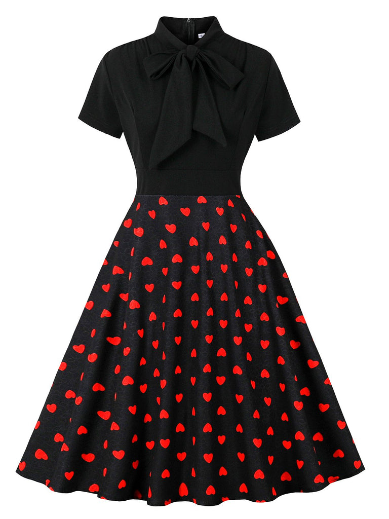 Robe noire à pois de cœur col noué des années 1950