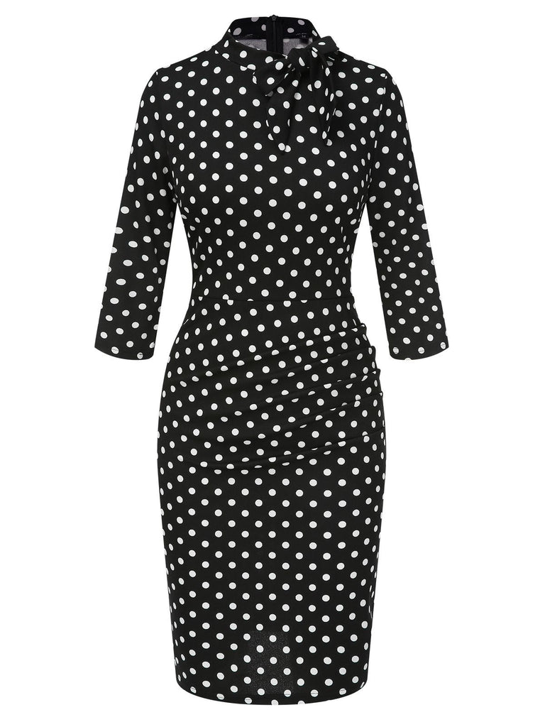 Robe noire à pois et col noué des années 1960