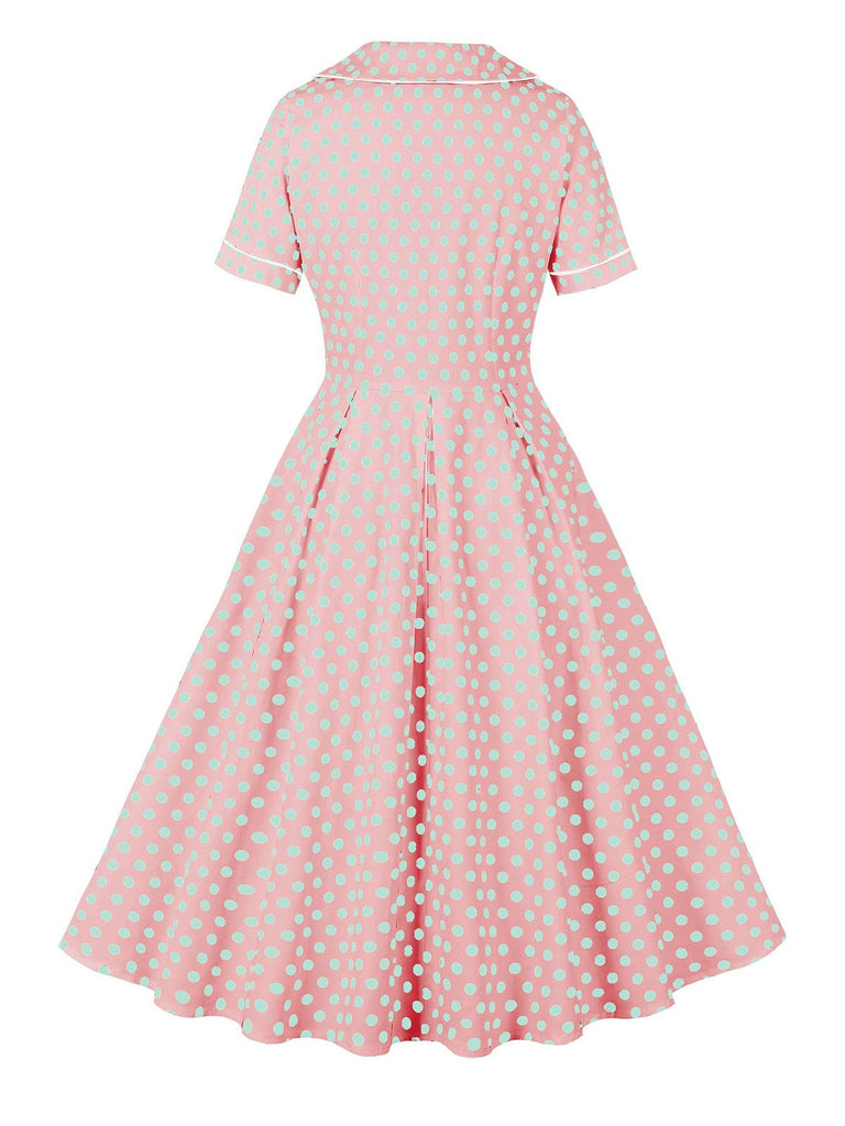 Robe rose à pois bleus à manches courtes des années 1950